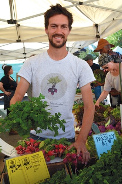 Max Becher of Ojai Valley Online Farmstand also works the Earthtrine Farm farmers’ market stand.