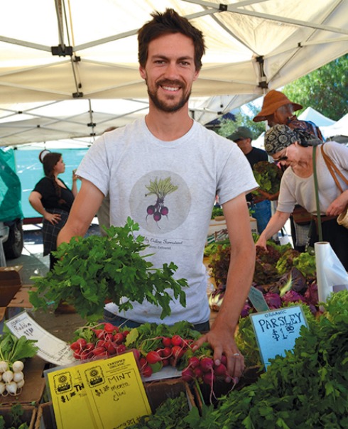 Max Becher of Ojai Valley Online Farmstand also works the Earthtrine Farm farmers’ market stand.