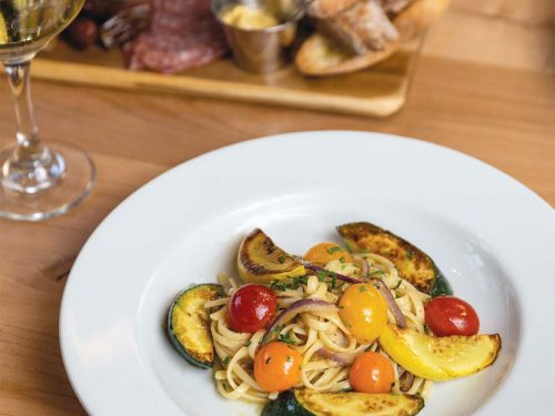Fresh market vegetable pasta and a charcuterie platter in Parque 1055’s outdoor patio can really hit the spot on a spring afternoon.